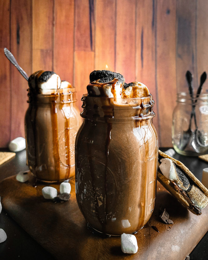 2 glasses full of S'mores hot chocolate with toasted marshmallows