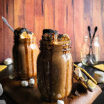 2 glasses full of S'mores hot chocolate with toasted marshmallows