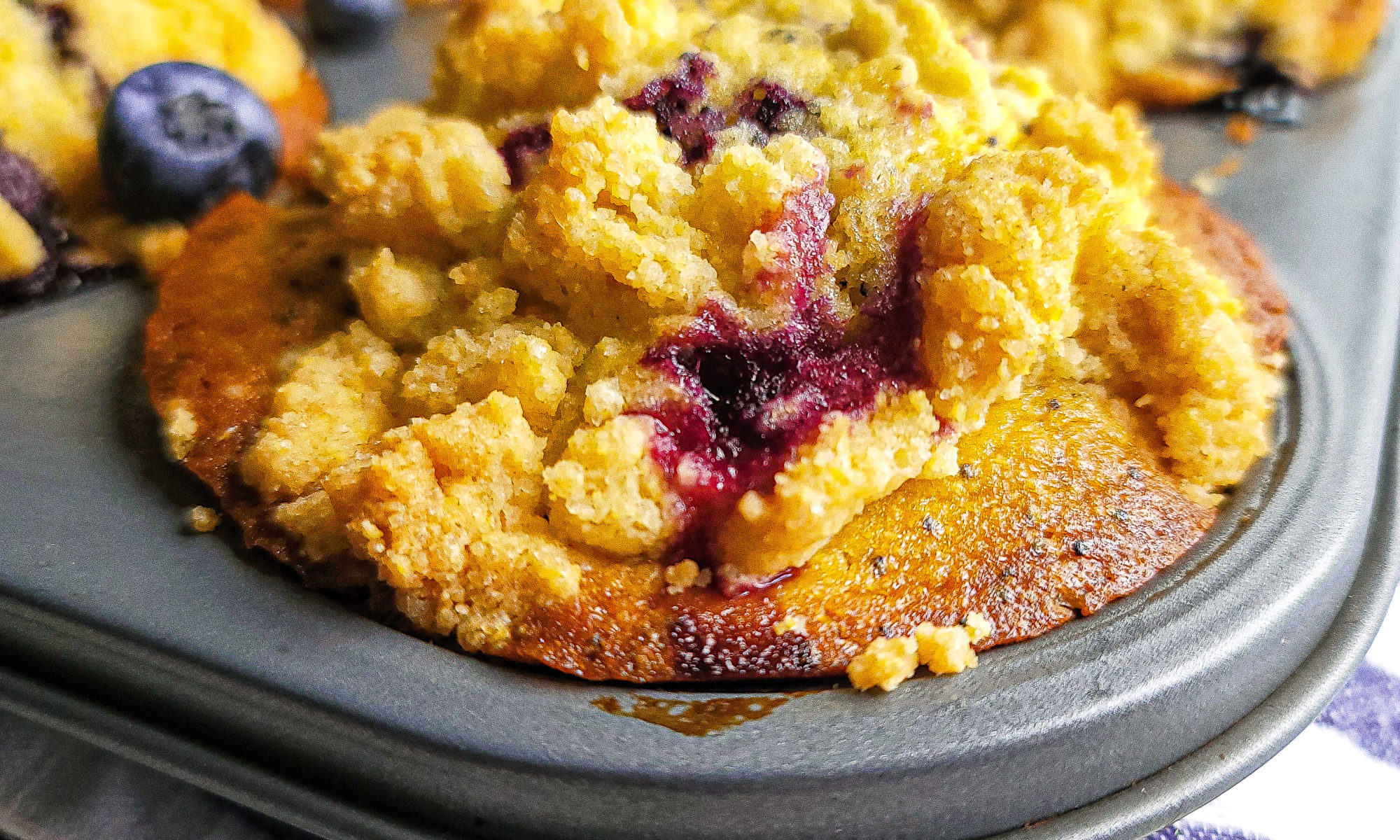 Close up shot of blueberry lemon poppyseed corn muffins